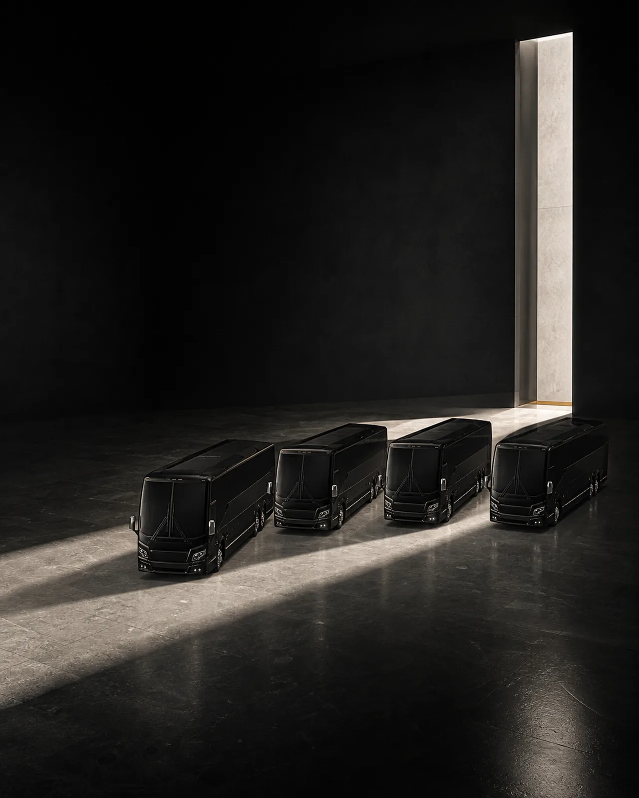 Four black Prevost H3-45 motorcoaches parked in a fanned arc in a dark space lit by a bright vertical light beam.